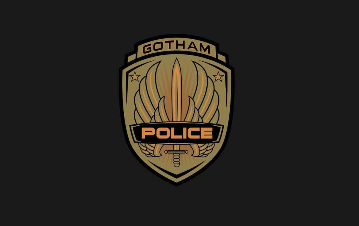 Gotham City Police Department 桌布 壁紙 — 金色高譚警察盾牌徽章，中央有劍和翅膀，置於黑色背景上。
