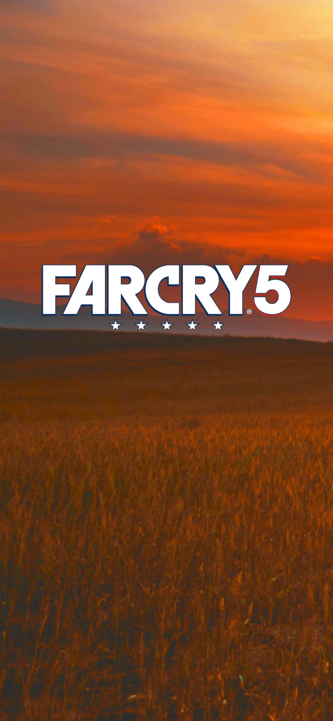 iPhone Xs Far Cry 5 桌布 壁紙 — 金色麥田在火橙色夕陽天空下延伸，中央有 Far Cry 5 標誌。