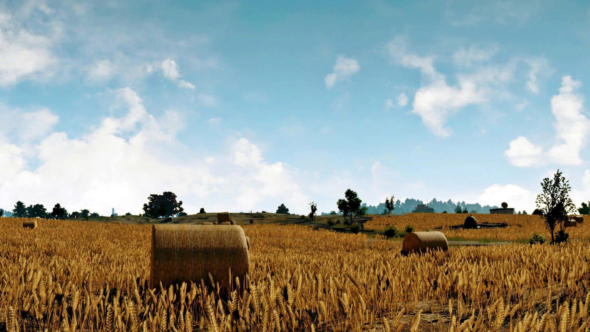 game 桌布 壁紙 — 金色麥田點綴著乾草捆，上方是明亮的藍天和蓬鬆的白雲。