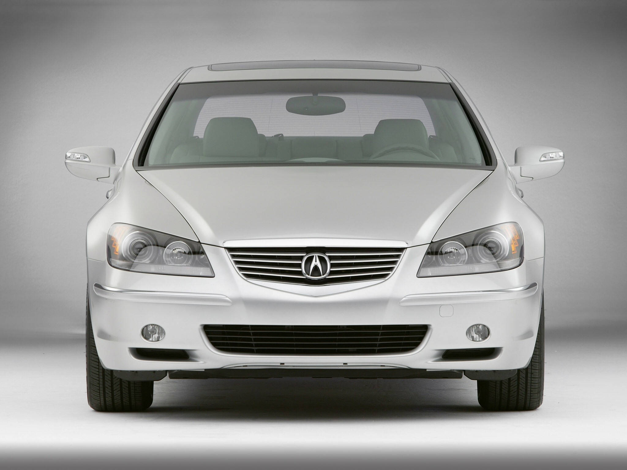 Acura 桌布 壁紙 — 銀色Acura TL轎車正面視圖，背景為中性灰色工作室。