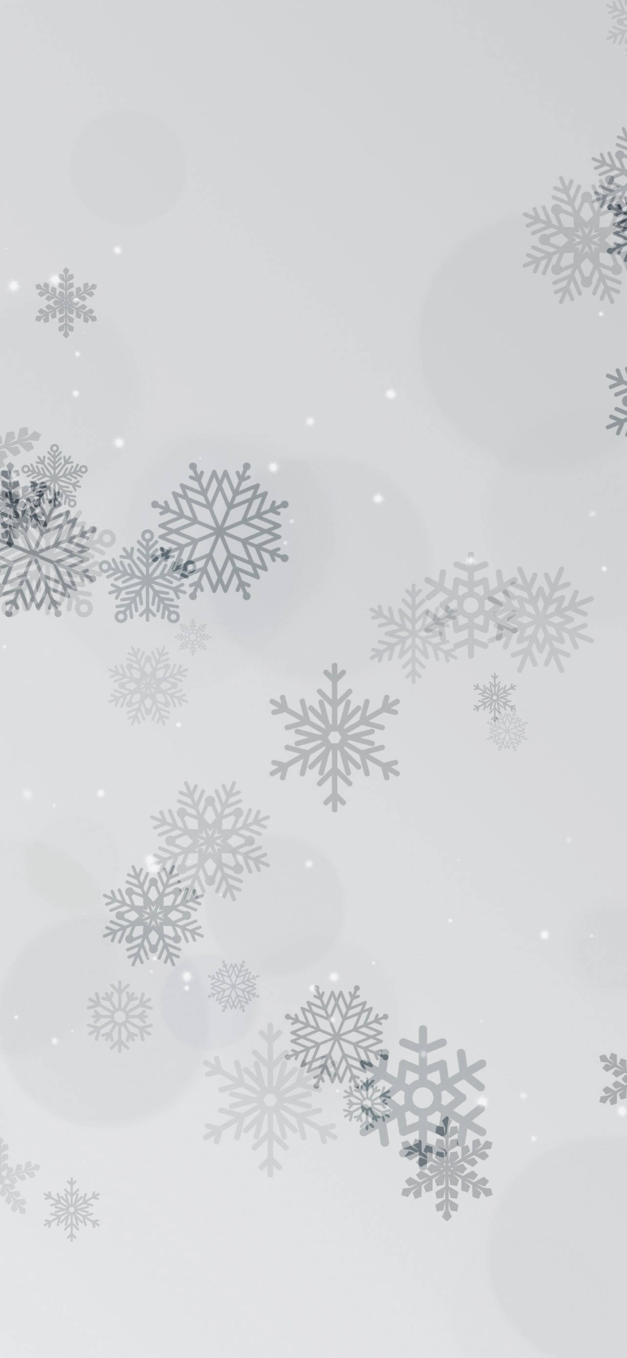 Snowflake iPhone 桌布 壁紙 — 銀色雪花在柔和的灰色背景上輕輕飄落，帶有微妙的散景燈光。
