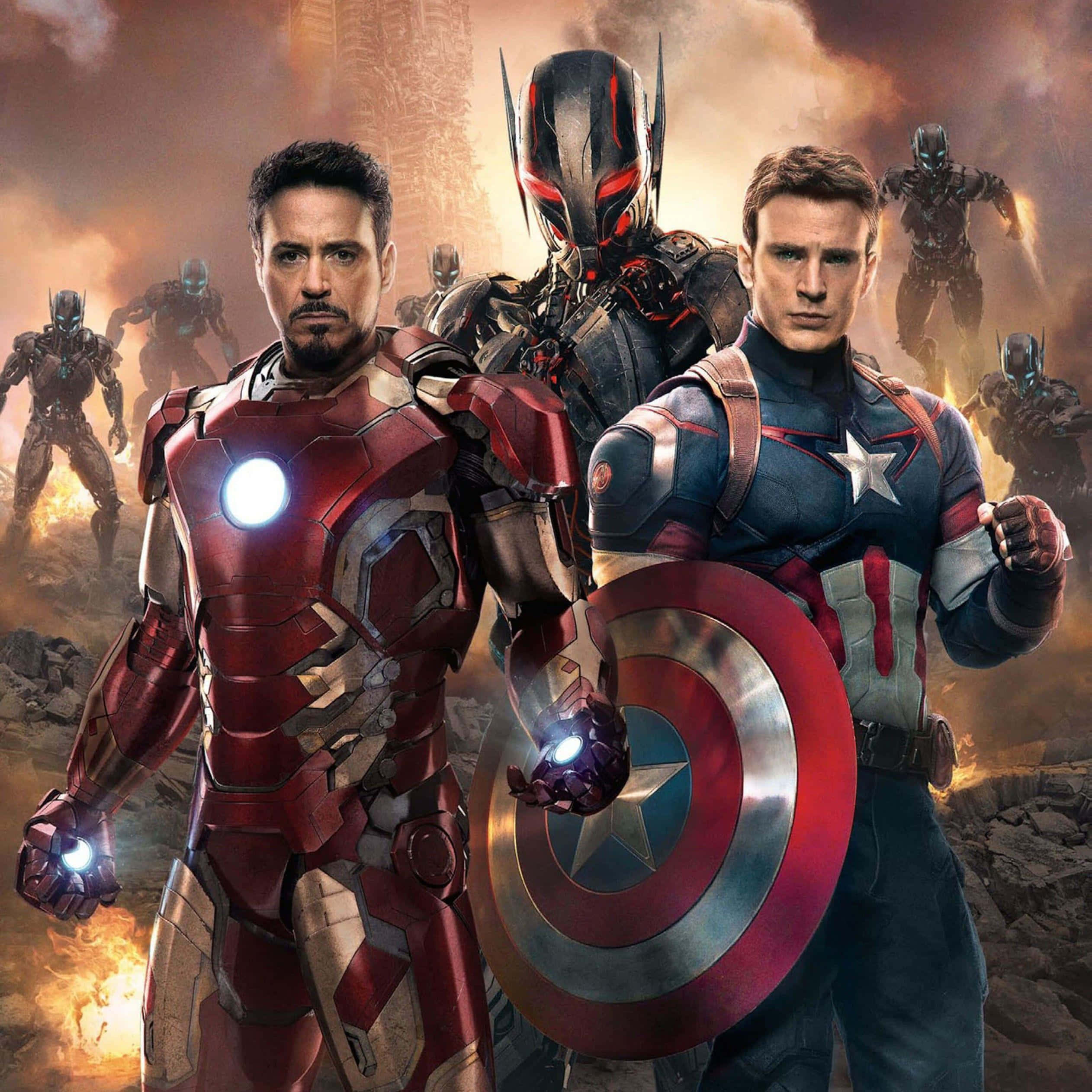 Iron Man Vs Captain America 桌布 壁紙 — 鋼鐵人和美國隊長在烈火戰場上堅定站立，蟻人和其他裝甲英雄在他們身後。