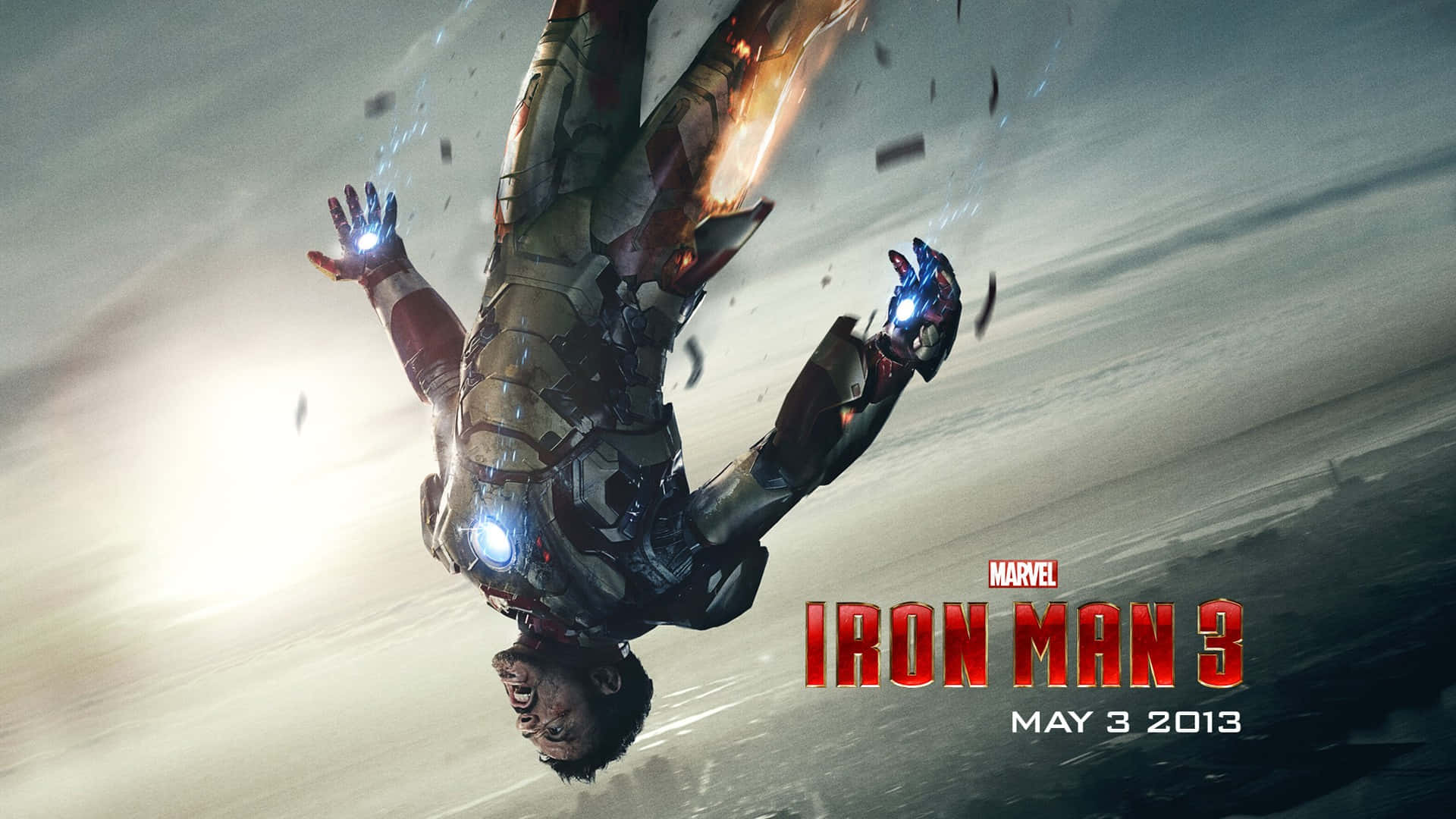 iron man 3 桌布 壁紙 — 鋼鐵人在暴風雨中墜落，發光的斥力炮周圍碎片飛舞。