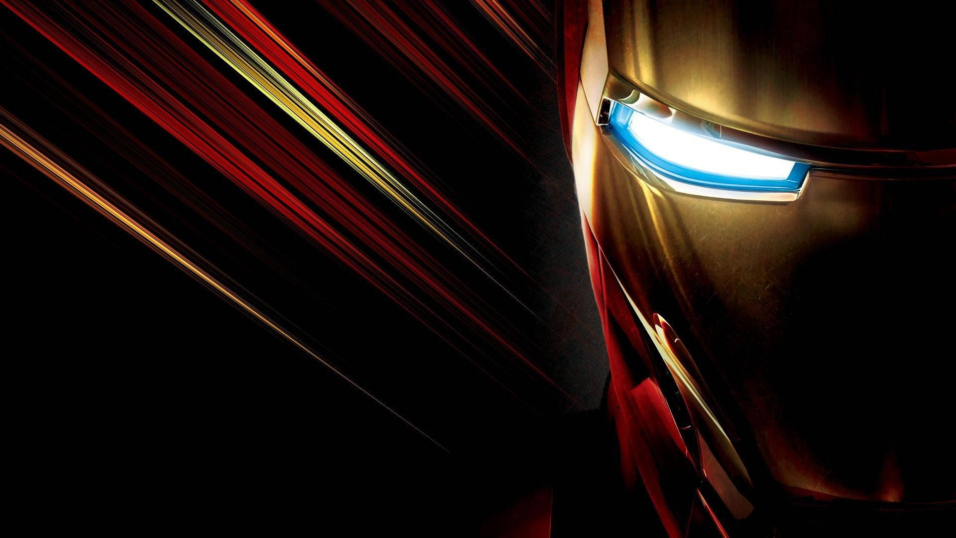 漫威 桌布 壁紙 — 鋼鐵人發光藍色眼睛的特寫，背景為帶有紅色和金色光線條紋的深色背景。