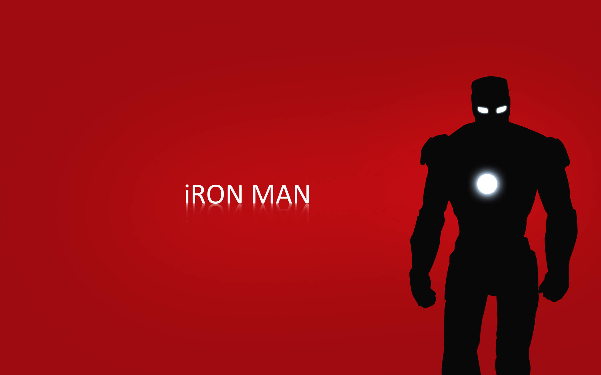 Iron Man Logo 桌布 壁紙 — 鋼鐵人的剪影站在大膽的紅色背景前，眼睛和胸部弧形反應爐發光。