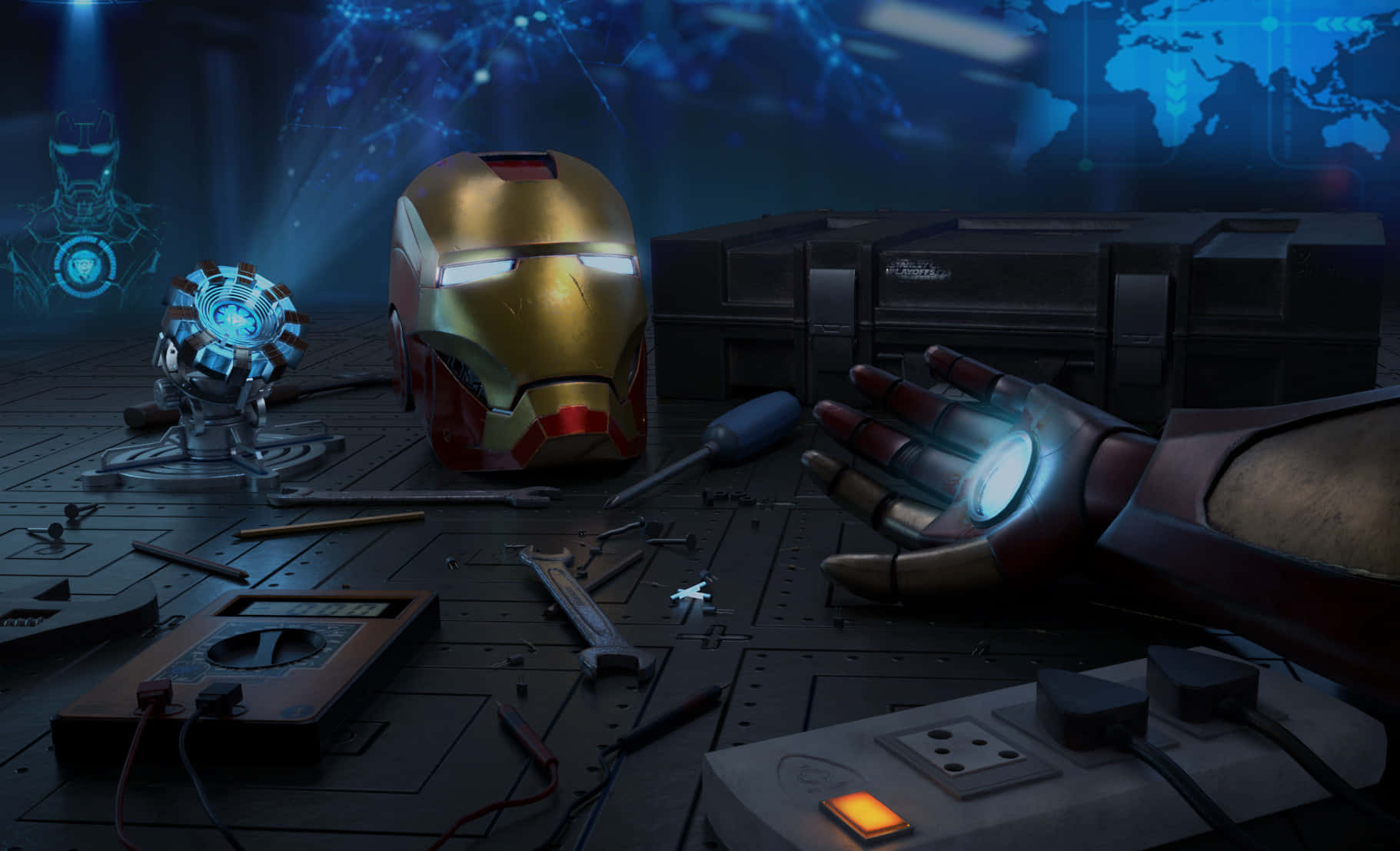 Iron Man Technology 桌布 壁紙 — 鋼鐵人的頭盔和發光手套放在一個雜亂的工作室地板上，周圍是工具和科技設備。