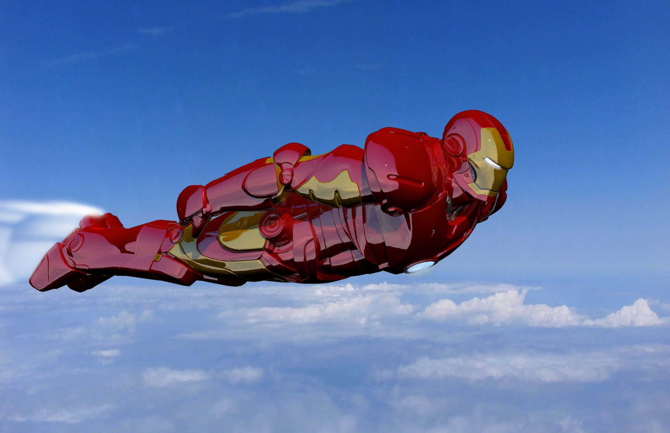 Best Iron Man 桌布 壁紙 — 鋼鐵人穿著標誌性的紅金色戰衣，在 fluffy 白雲之上的清澈藍天中翱翔。