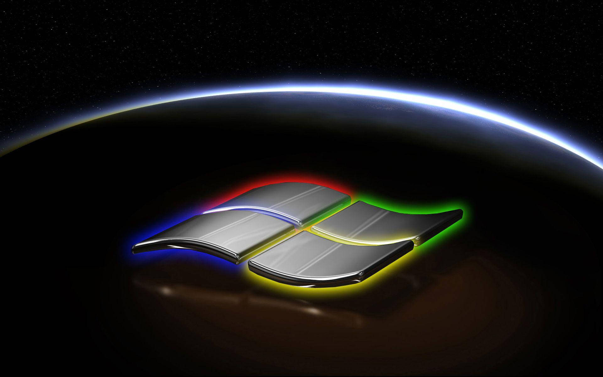 Windows 11 桌布 壁紙 — 閃亮的Windows標誌在太空中地球彎曲的地平線上發出彩虹光芒。