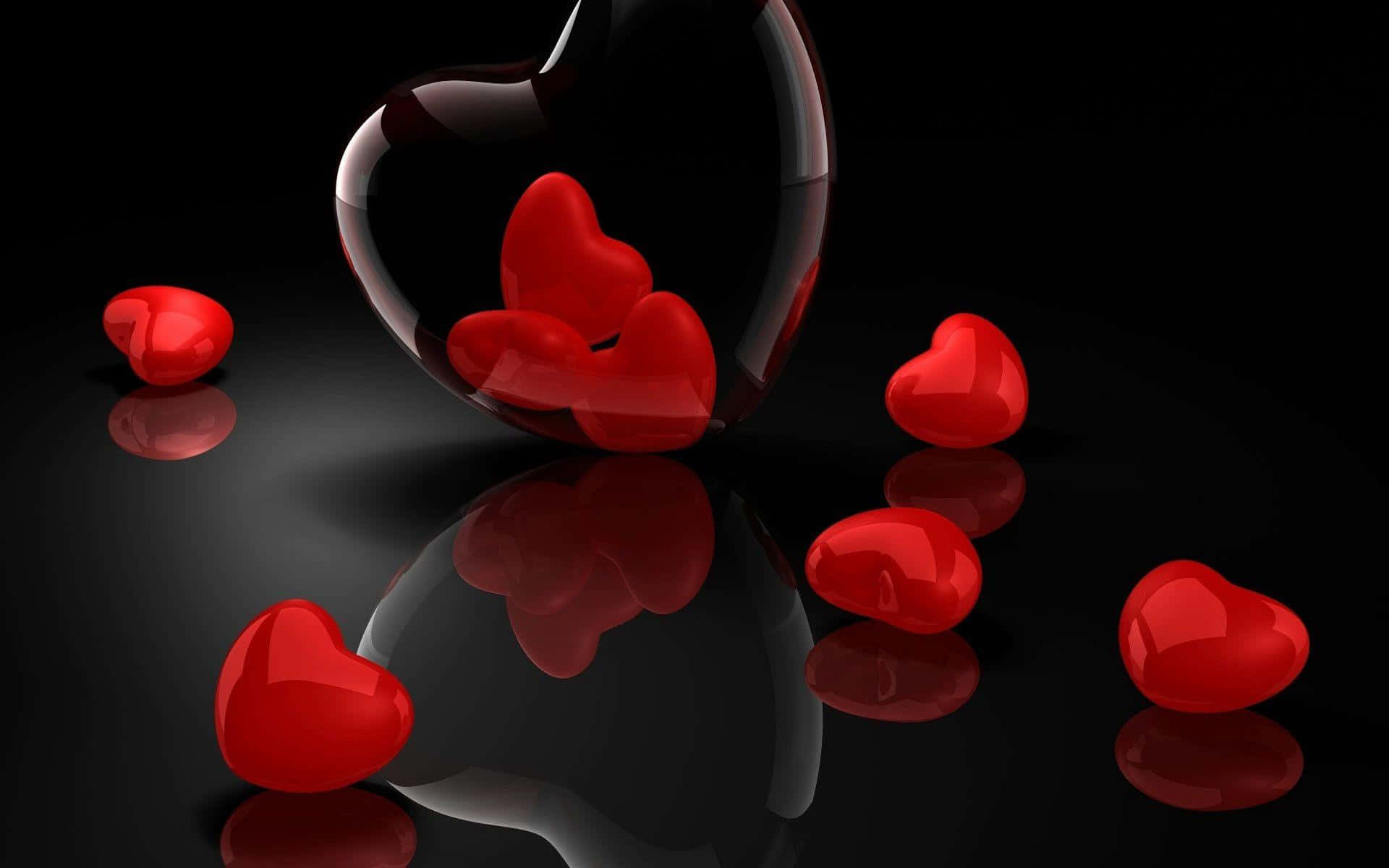 Beautiful Love 桌布 壁紙 — 閃亮的紅色心形從破碎的黑色心形中溢出，落在反光的黑色表面上。