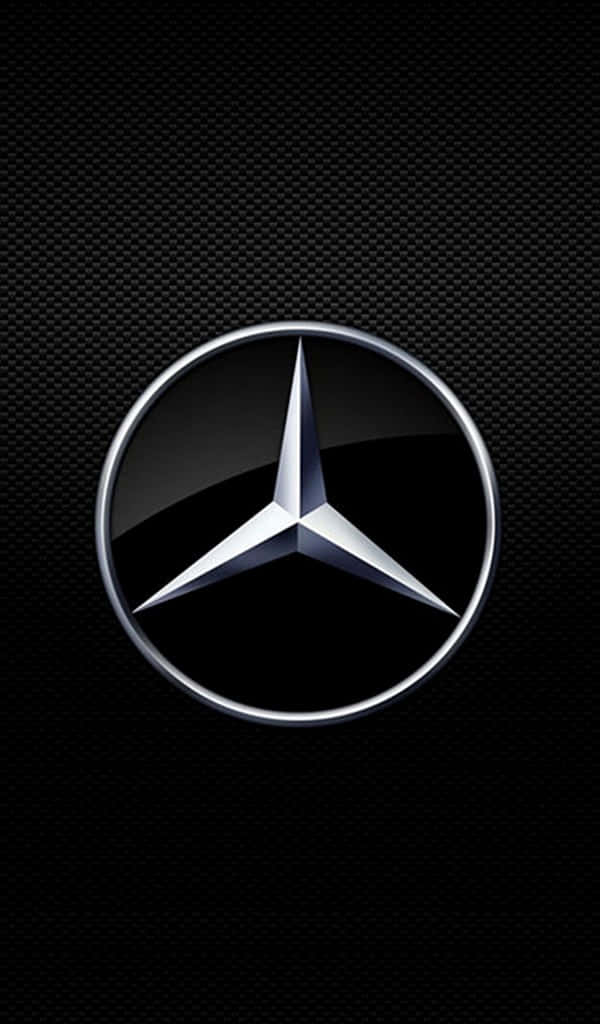 600x1024 桌布 壁紙 — 閃亮的銀色Mercedes-Benz標誌置於有紋理的黑色碳纖維背景中央。