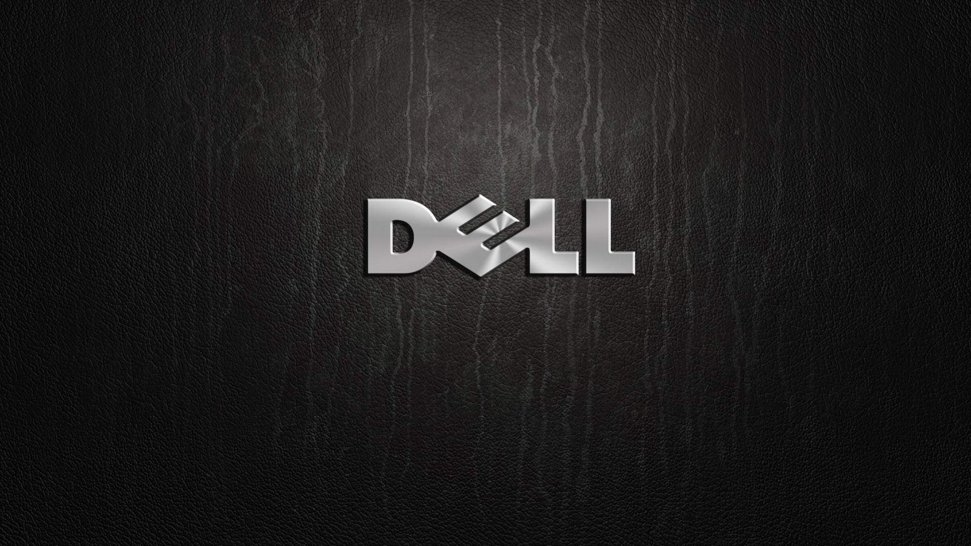 Dell Laptop 桌布 壁紙 — 閃亮銀色 Dell 標誌居中於帶有細微垂直紋理的黑色皮革背景上。