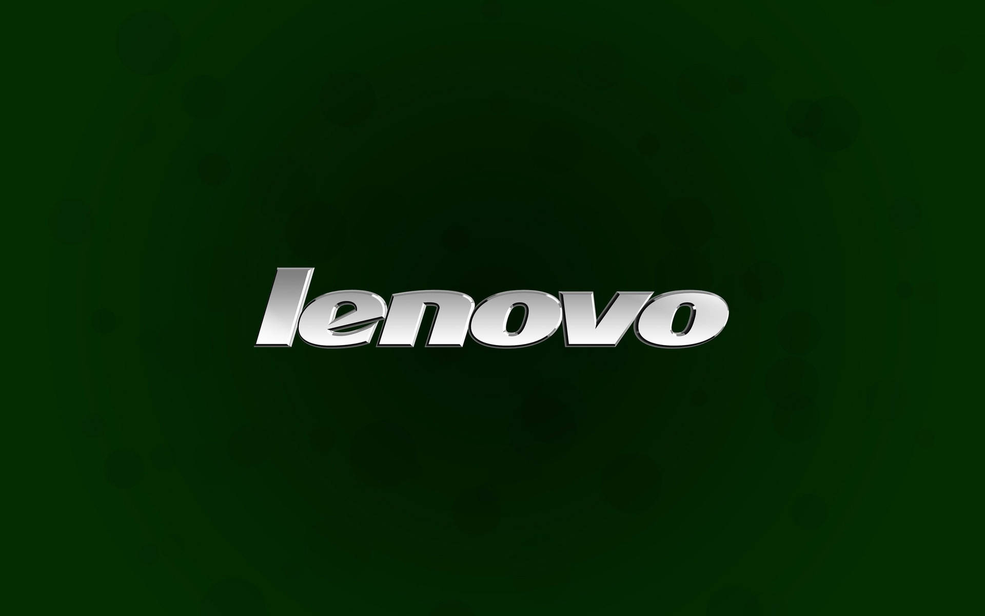 Logo 桌布 壁紙 — 閃亮銀色 Lenovo 標誌置中於深綠色漸變背景上，帶有微妙的圓形圖案。