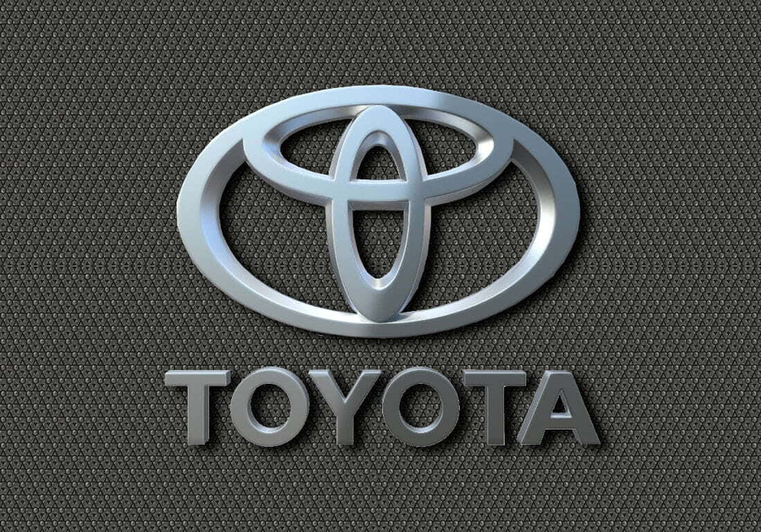 深色紋理背景上的閃亮銀色豐田標誌。 — Toyota Supra Mk4 壁紙
