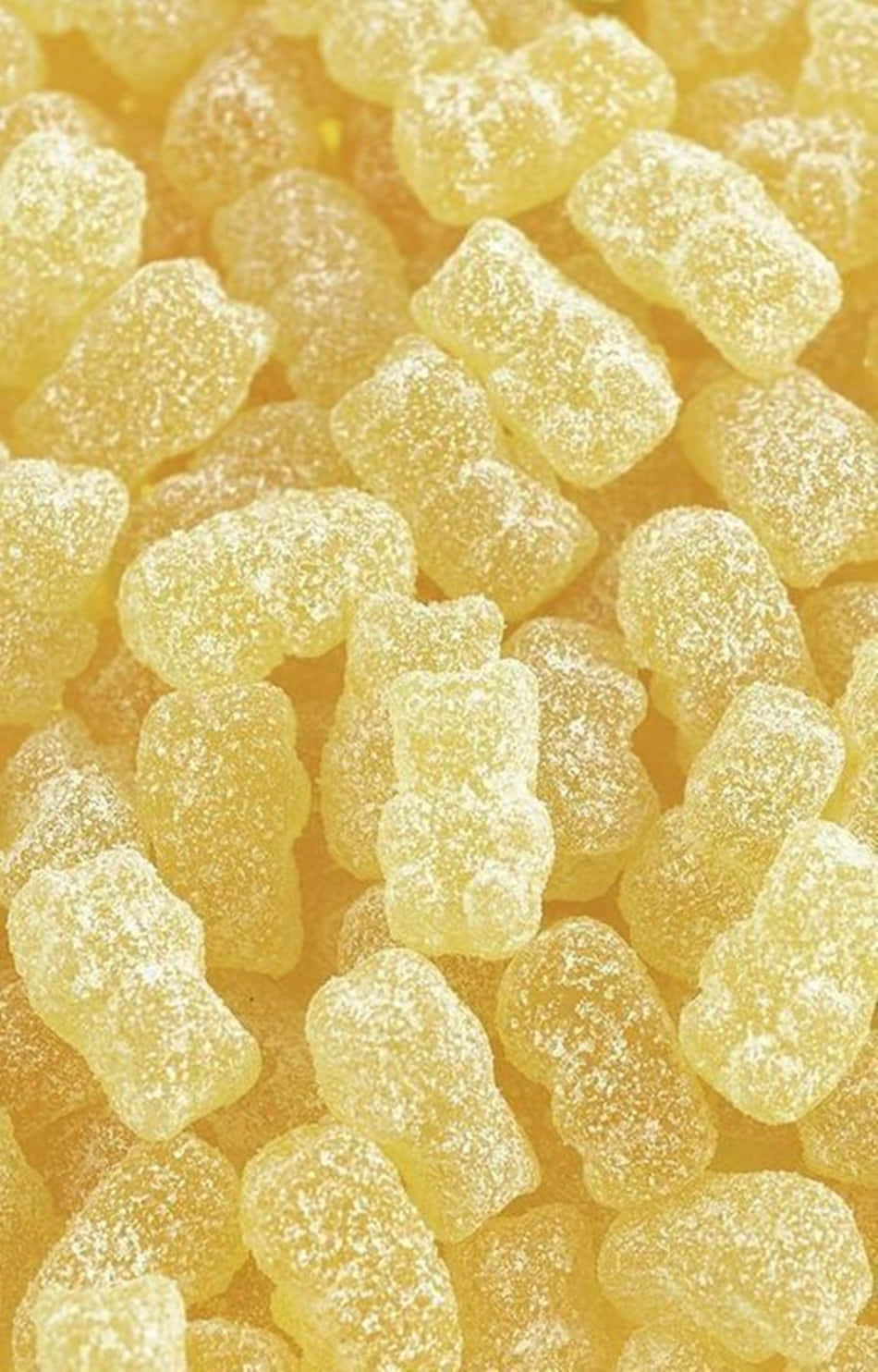 Yellow 桌布 壁紙 — 閃亮黃色軟糖熊的微距特寫，撒上糖晶。