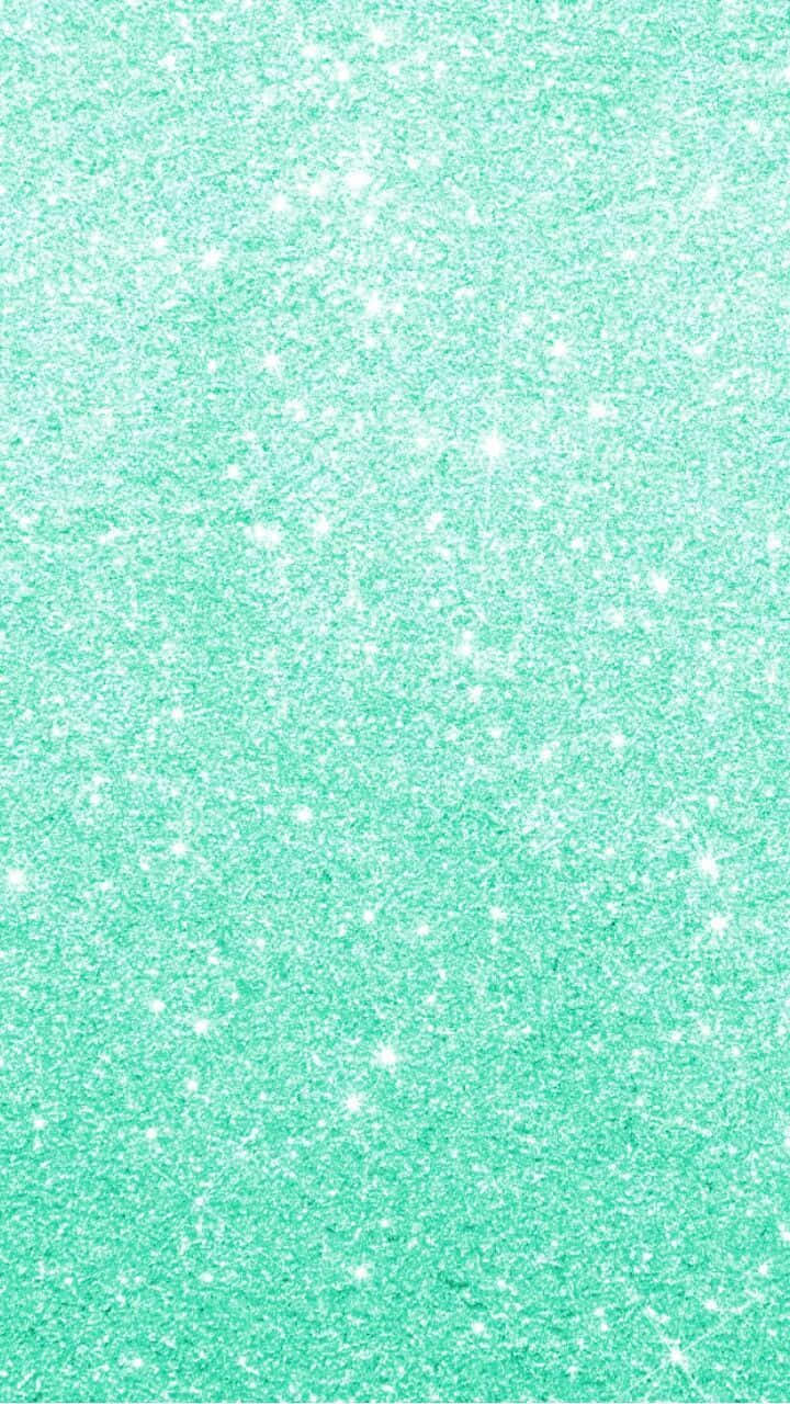 Aqua Green 桌布 壁紙 — 閃爍的薄荷綠色亮粉質感，表面散佈著明亮的白色閃光。