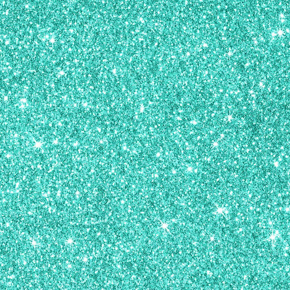 Green Glitter 桌布 壁紙 — 閃爍的藍綠色亮片質感，帶有明亮的白色閃光散落在閃爍的表面上。
