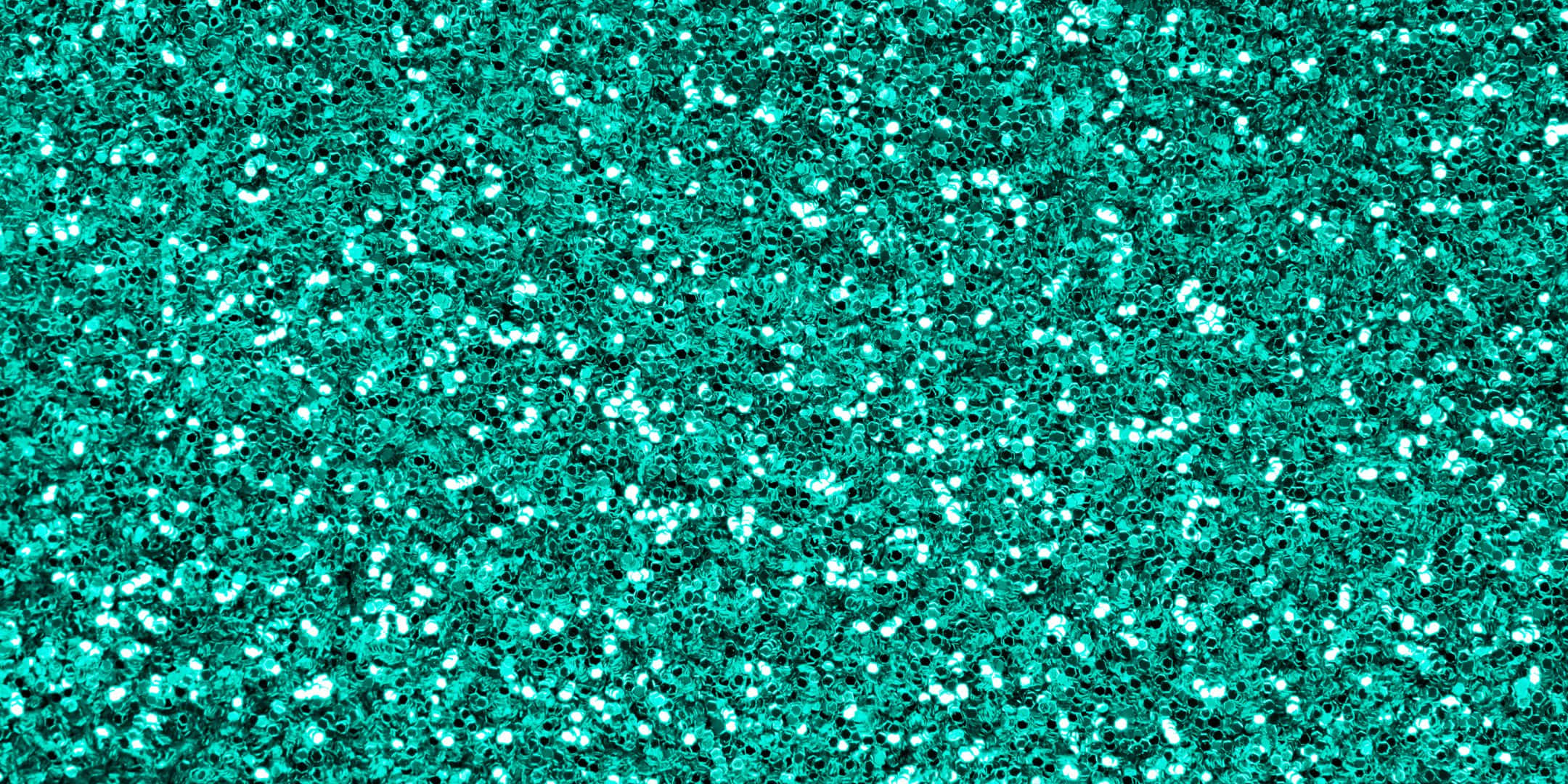 Teal Glitter 桌布 壁紙 — 閃爍的藍綠色亮粉紋理，帶有明亮的白色斑點在充滿活力的表面上閃閃發光。