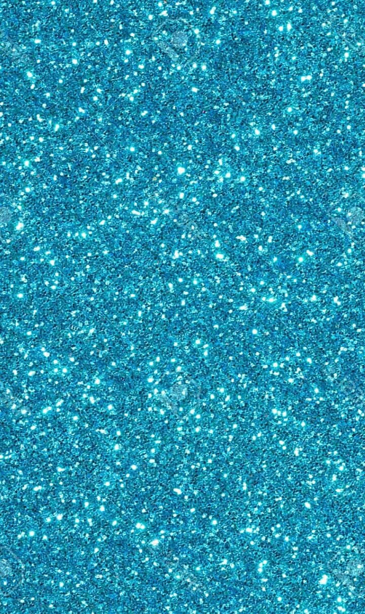 Blue Glitter 桌布 壁紙 — 閃爍的藍色亮片質感，帶有明亮的白色斑點，在整個畫面中捕捉光線。