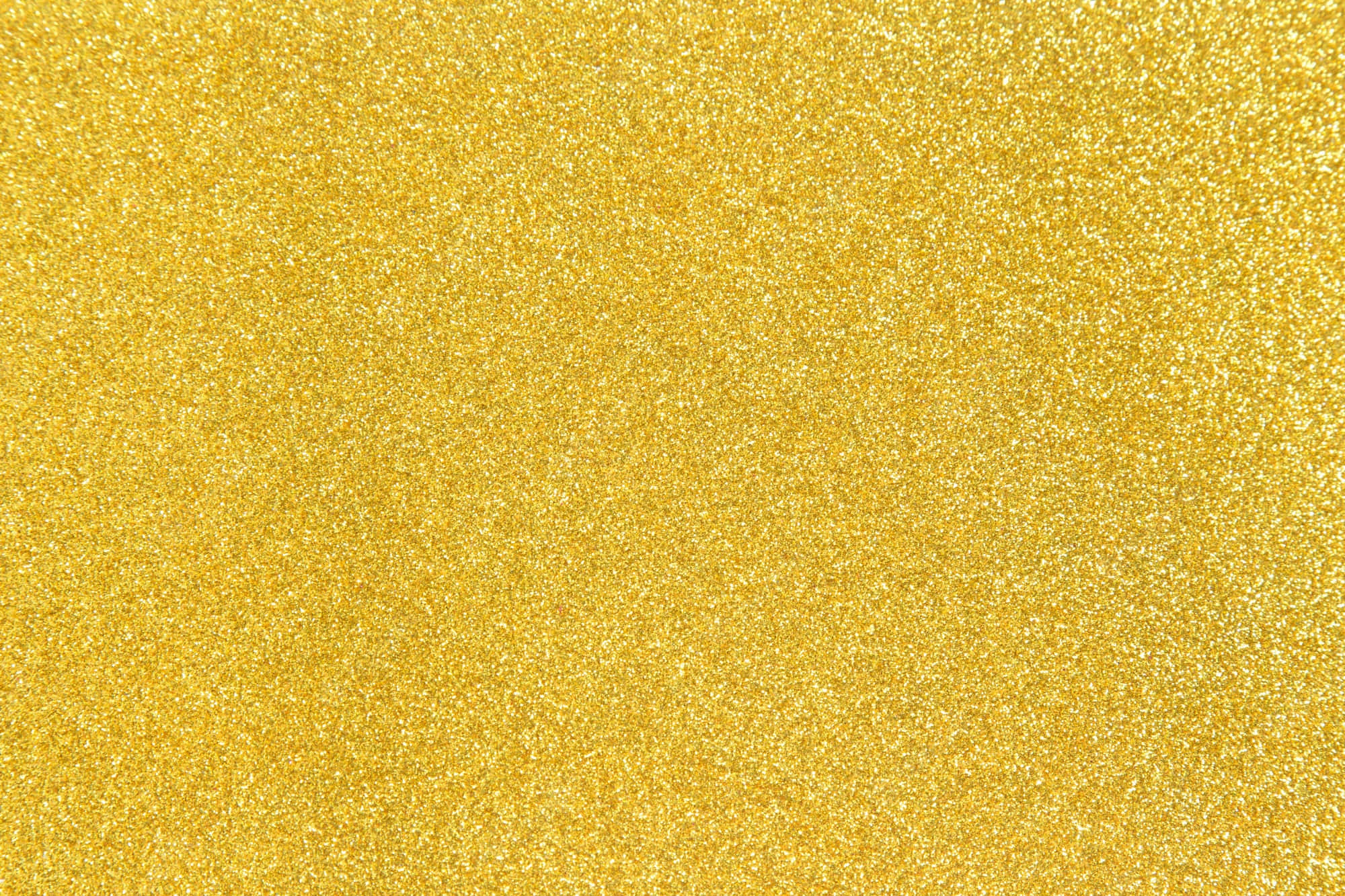 Yellow Glitter 桌布 壁紙 — 閃爍的金色亮片紋理，閃亮顆粒覆蓋整個畫面。