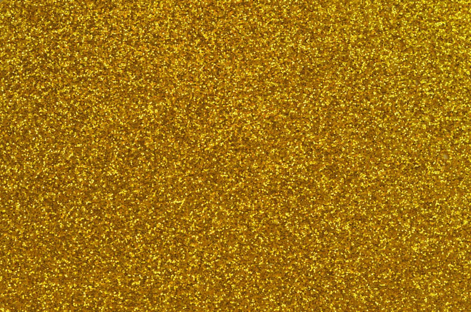 Sparkle 桌布 壁紙 — 閃爍的金色亮粉紋理充滿畫面，閃閃發光的粒子捕捉光線。