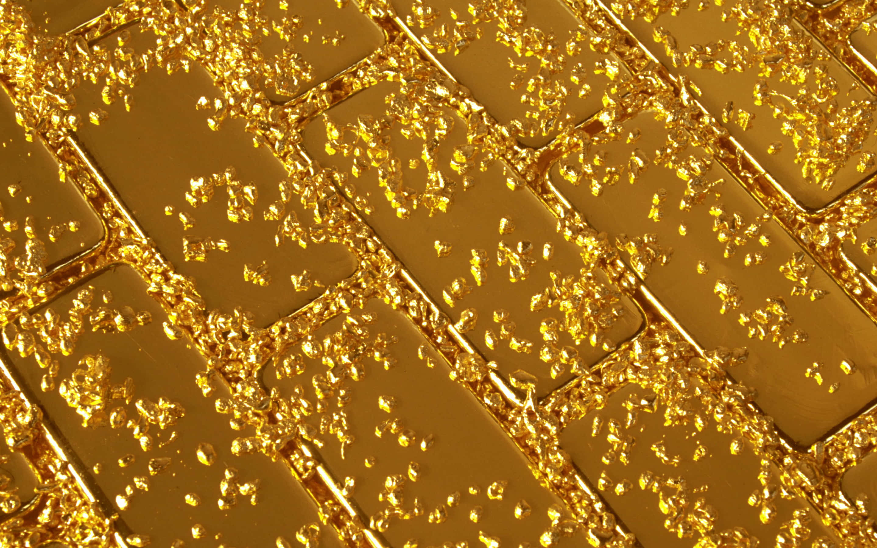 Shiny Gold 桌布 壁紙 — 閃爍的金色薄片在拋光金條的網格上層層疊落，營造出奢華耀眼質感。