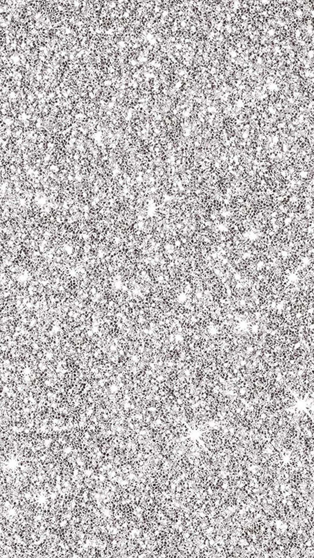 Silver Aesthetic iPhone 桌布 壁紙 — 閃爍的銀色亮片紋理，帶有明亮的星形閃光，散佈在閃閃發光的表面上。
