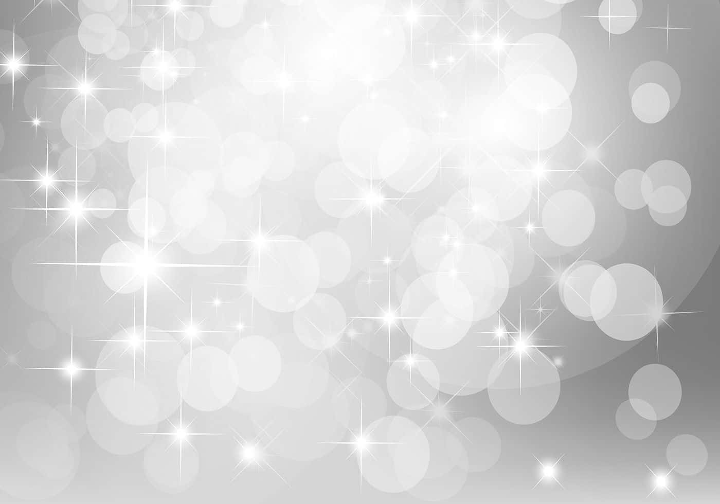 Bokeh 桌布 壁紙 — 閃爍的銀色背景，充滿發光的散景圓圈和閃爍的星光。