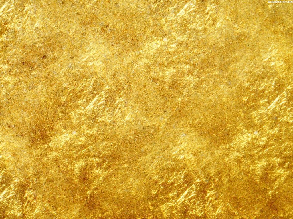 Gold Texture 桌布 壁紙 — 閃爍紋理金箔的微距特寫，帶有複雜的葉脈和溫暖的高光。