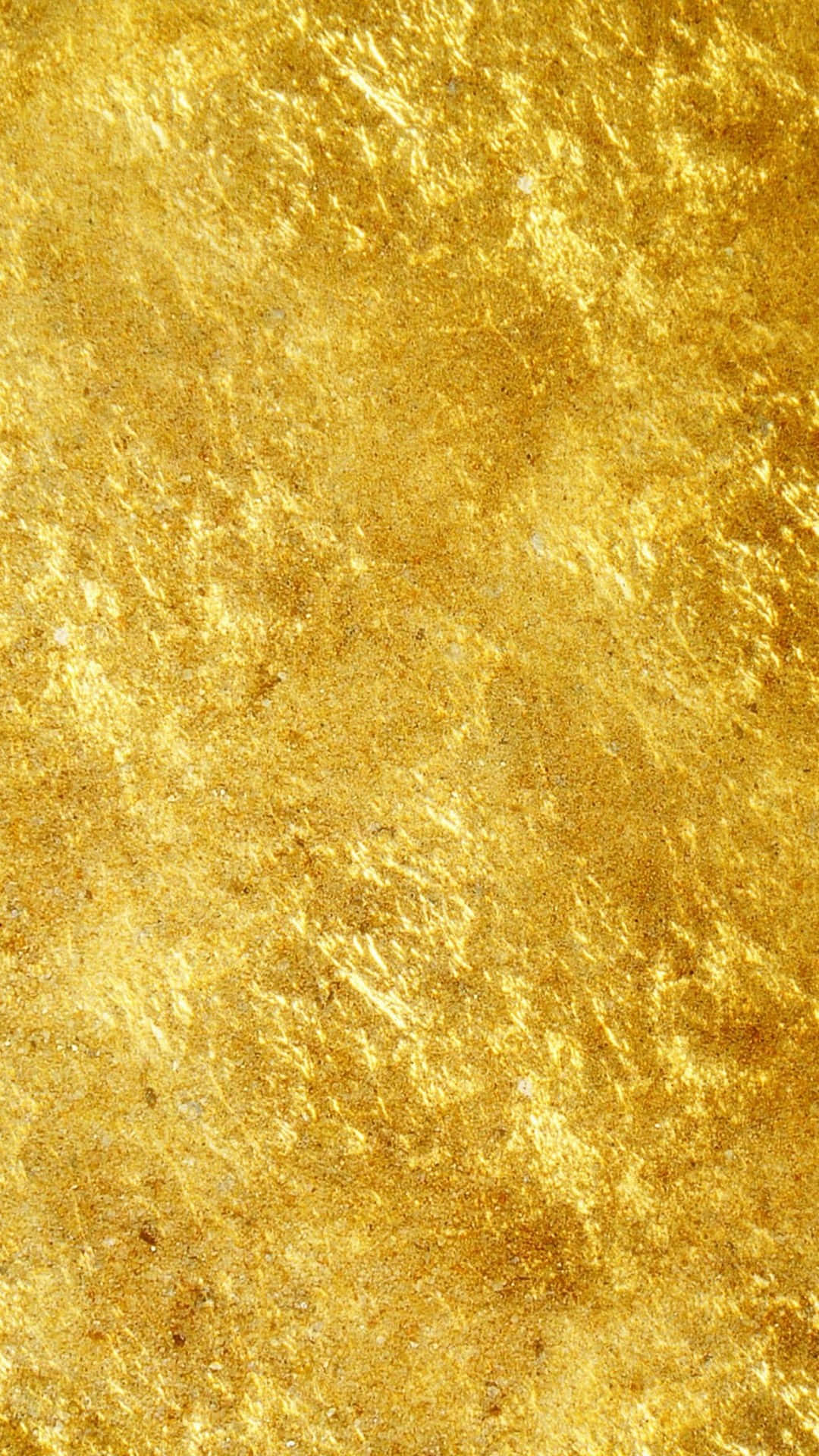 Gold iPhone 桌布 壁紙 — 閃爍紋理金箔的特寫，帶有複雜的紋路和微妙的光澤變化。