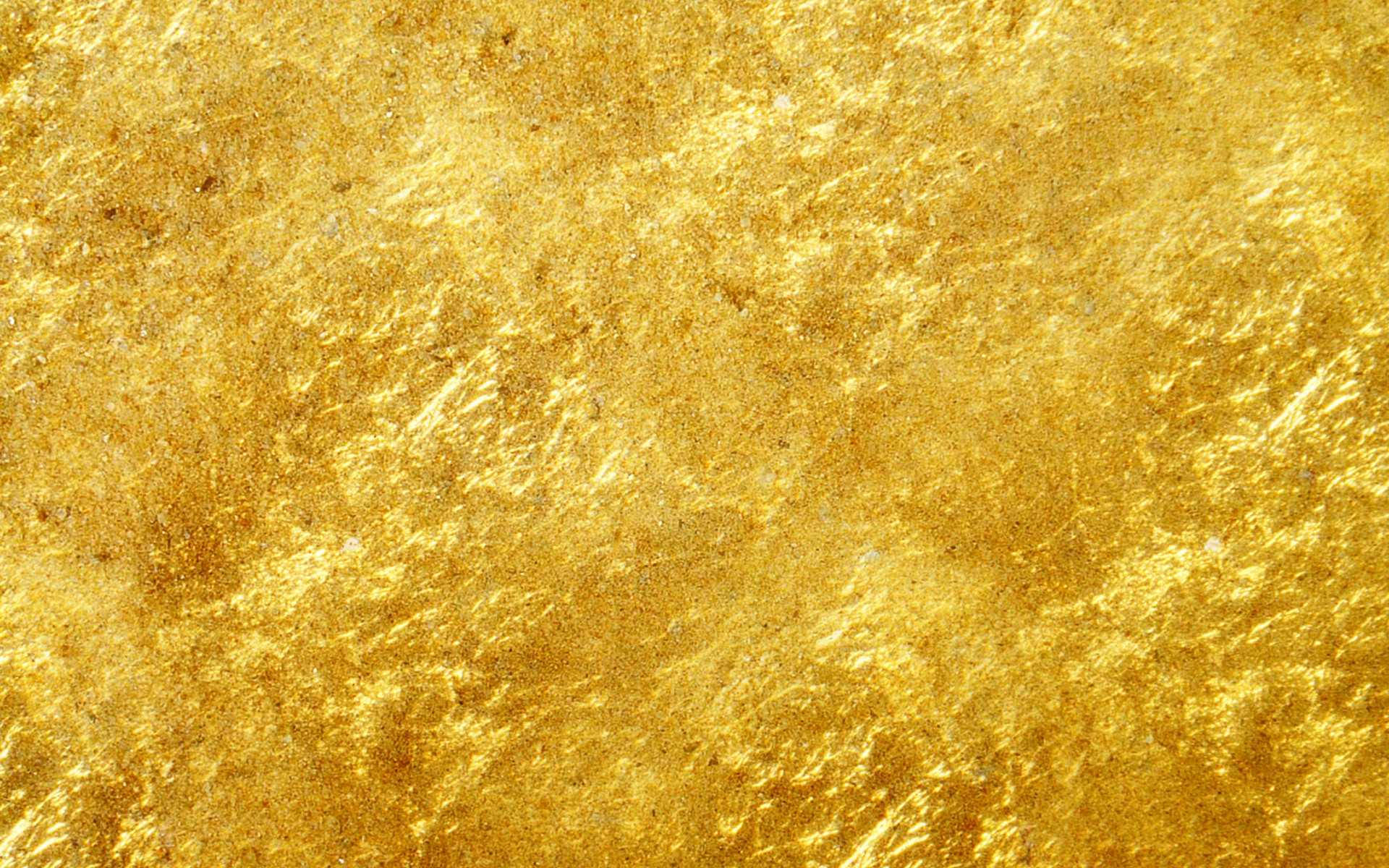 Gold Abstract 桌布 壁紙 — 閃爍紋理金箔的特寫，表面反射出微妙的色調和光線變化。