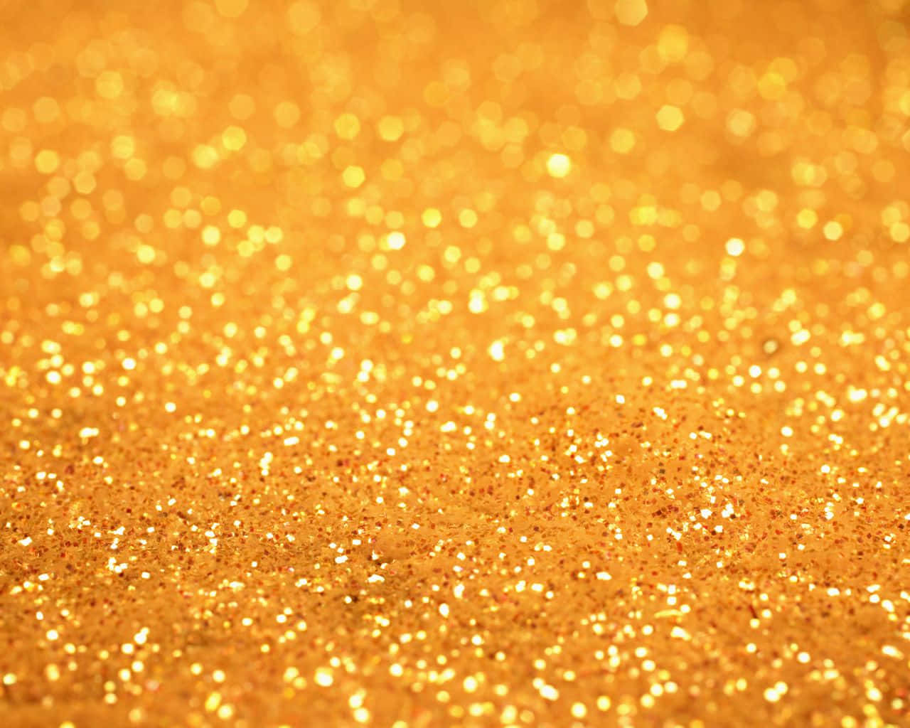 Orange Glitter 桌布 壁紙 — 閃爍金色亮片的特寫，散景高光營造出光彩奪目的紋理表面。