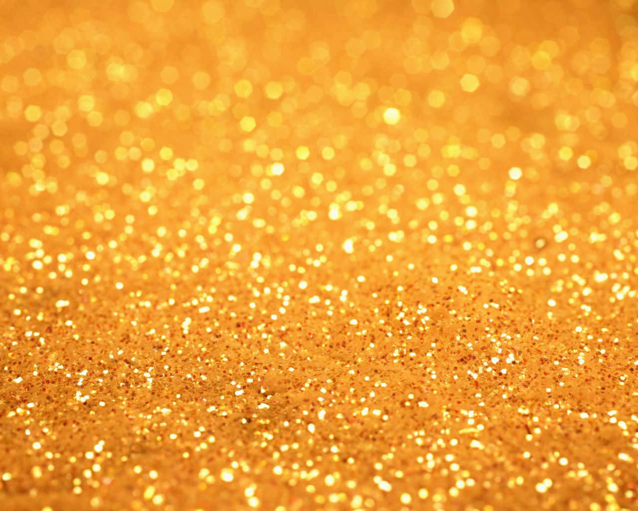 Yellow Glitter 桌布 壁紙 — 閃爍金色亮片的近距離特寫，帶有散景高光，營造出光彩奪目的閃爍質感。