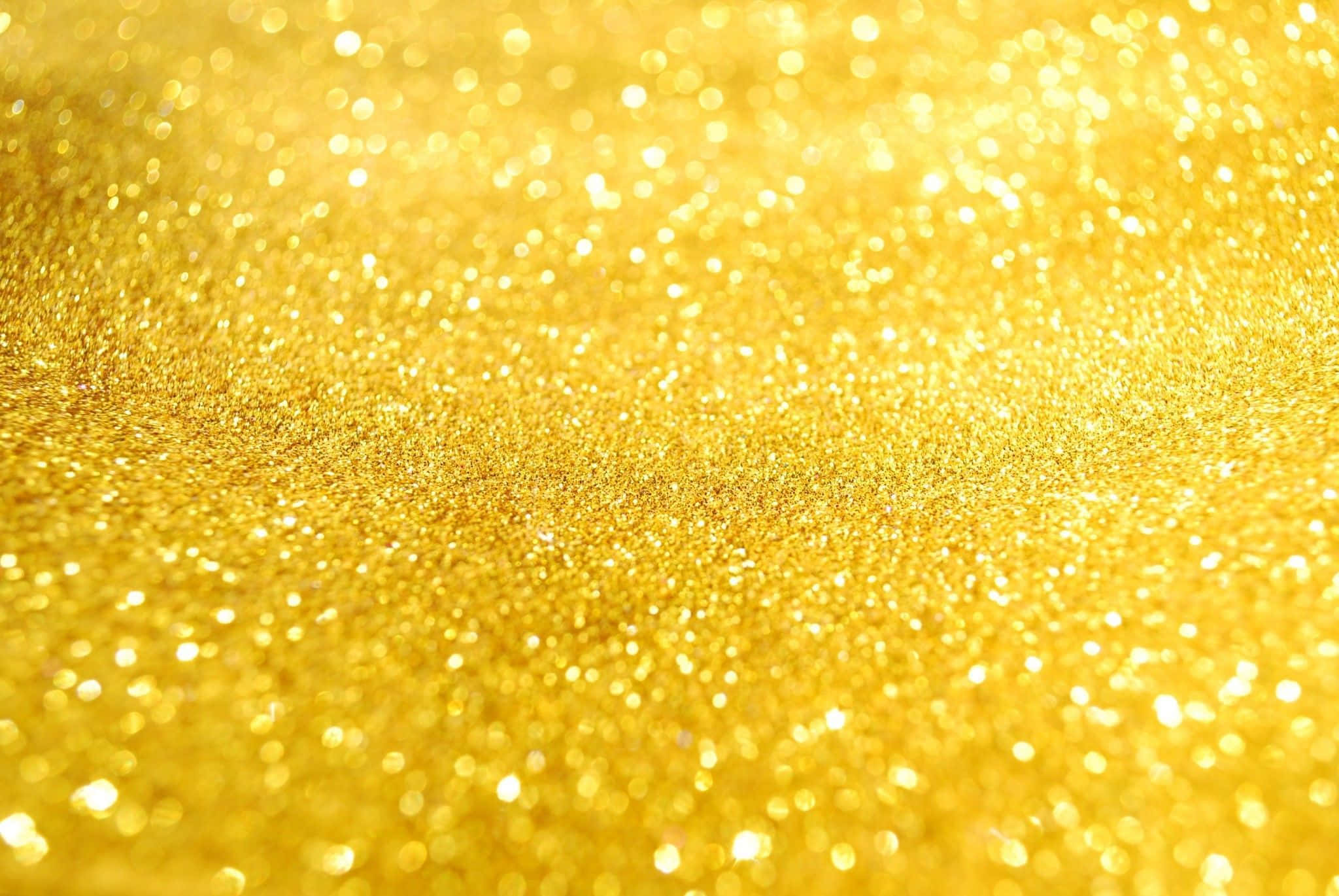 Yellow Glitter 桌布 壁紙 — 閃爍金色亮粉的特寫，帶有散景高光，營造出奢華閃爍的質感。