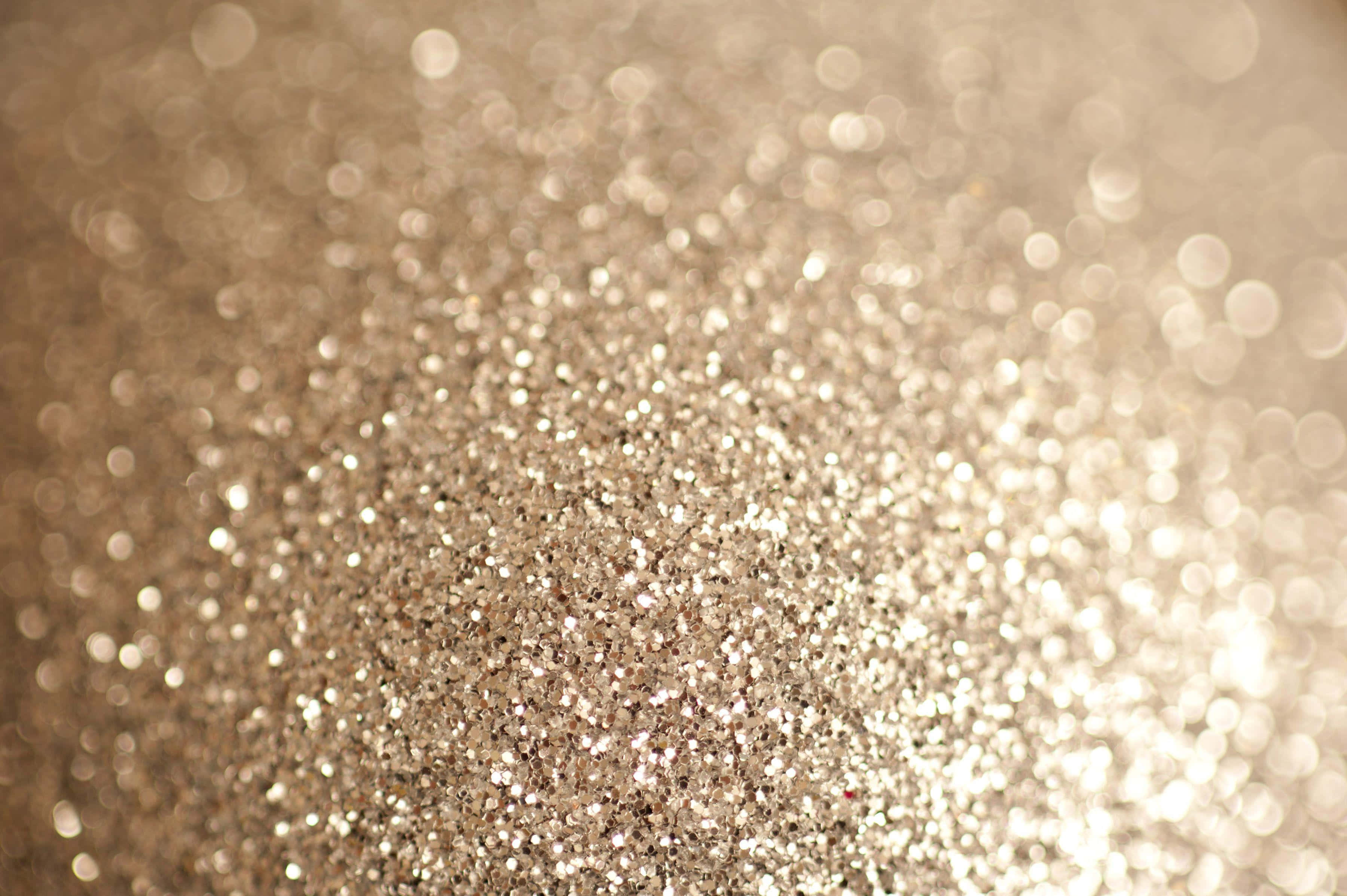 Shimmer 桌布 壁紙 — 閃爍金色亮粉的特寫，柔和散景高光營造出奢華閃亮的質感。