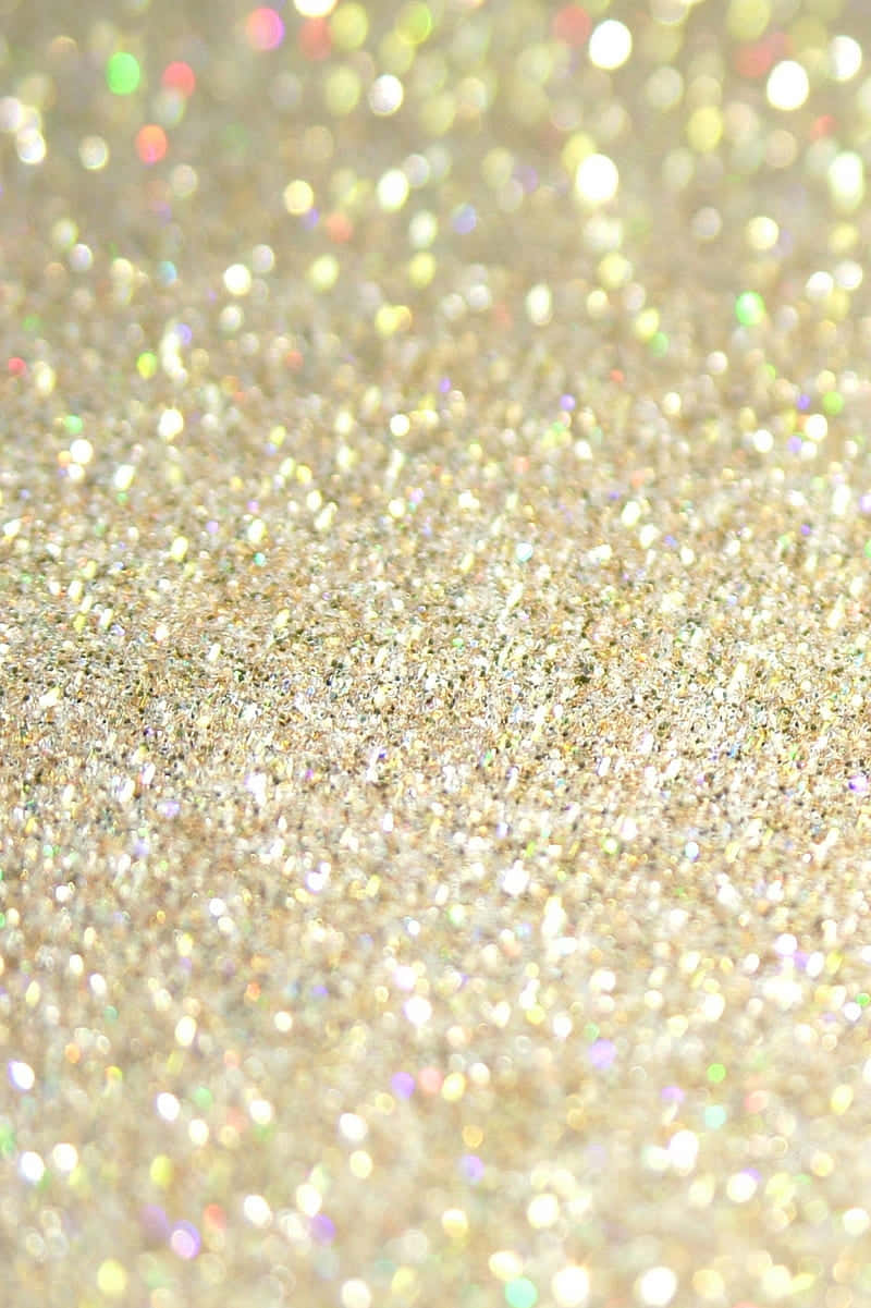 Yellow Glitter 桌布 壁紙 — 閃爍金色亮粉的特寫，柔和散景高光營造出奢華閃亮的質感。