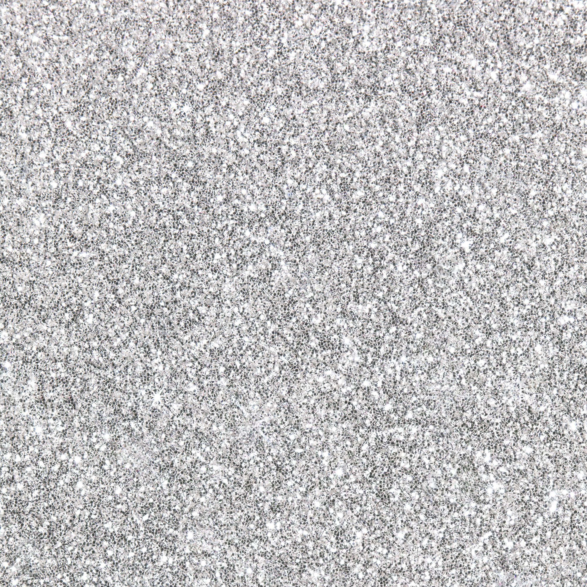 Glittery 桌布 壁紙 — 閃爍銀色亮粉的特寫，閃亮顆粒散佈在紋理表面上。