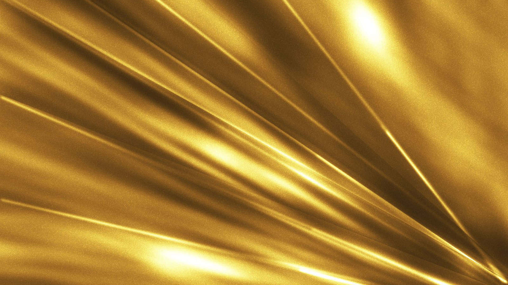設計 桌布 壁紙 — 閃耀的金色布料以動態的對角皺褶流動，捕捉明亮光線，營造奢華的抽象質感。