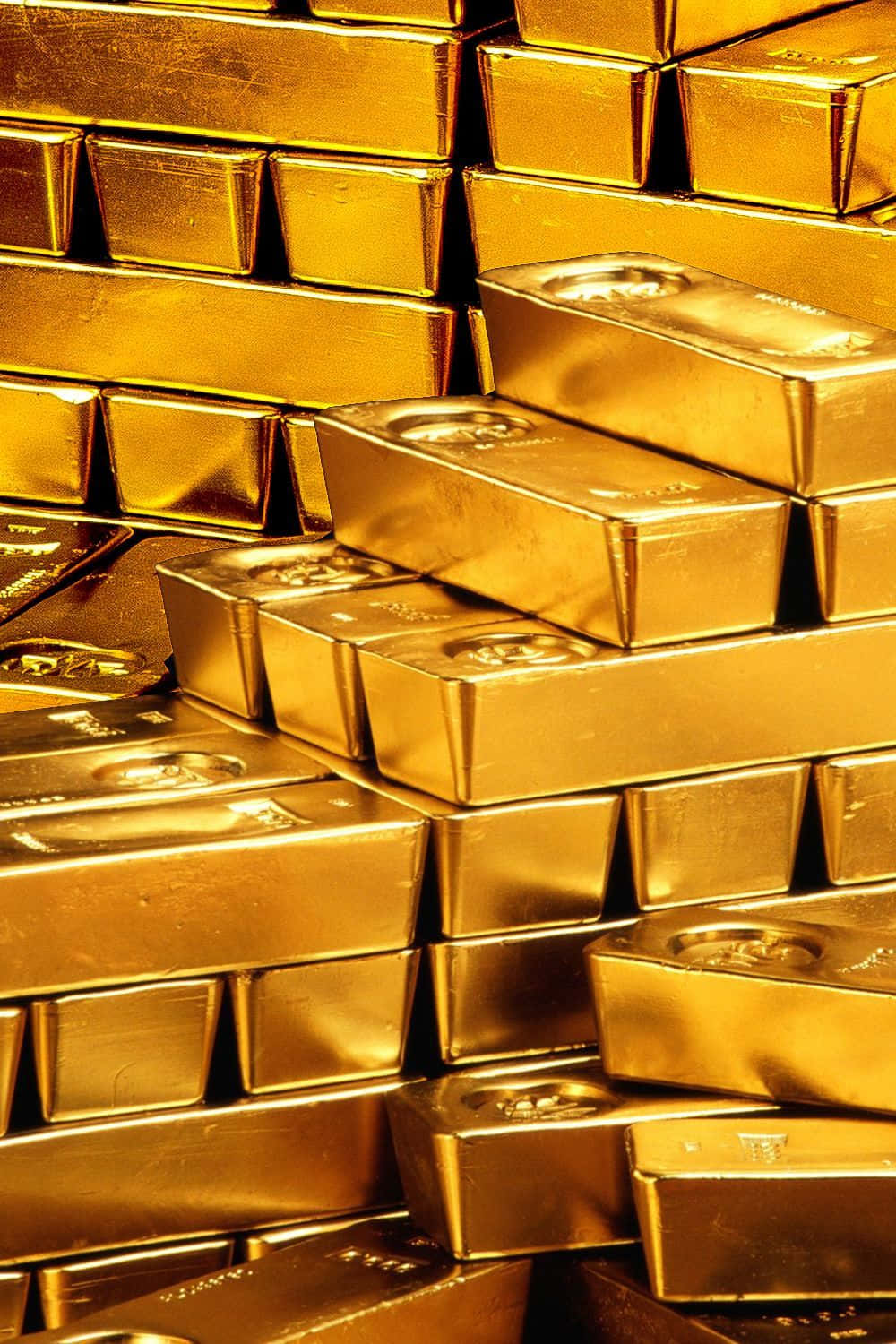 金色動態 桌布 壁紙 — 閃閃發光的金條堆在特寫鏡頭中反射出溫暖的光線，強調其金屬光澤和精確邊緣。