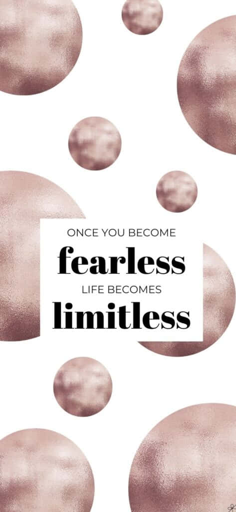 Limitless 桌布 壁紙 — 關於無畏的勵志名言，周圍環繞著漂浮的玫瑰金球體，背景為白色。
