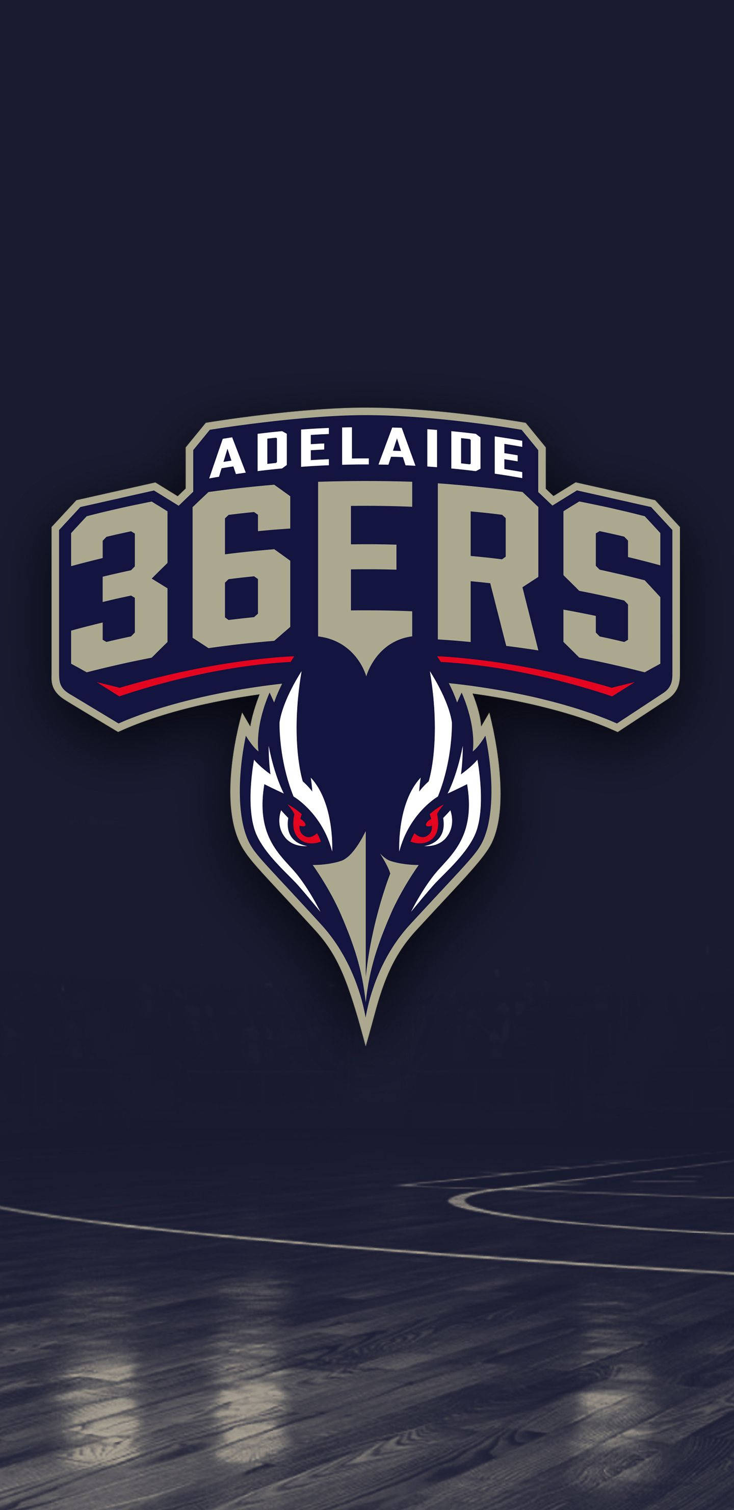 Adelaide 桌布 壁紙 — 阿德萊德36人籃球隊標誌，中央是一隻兇猛的鳥頭，位於拋光木地板上方。