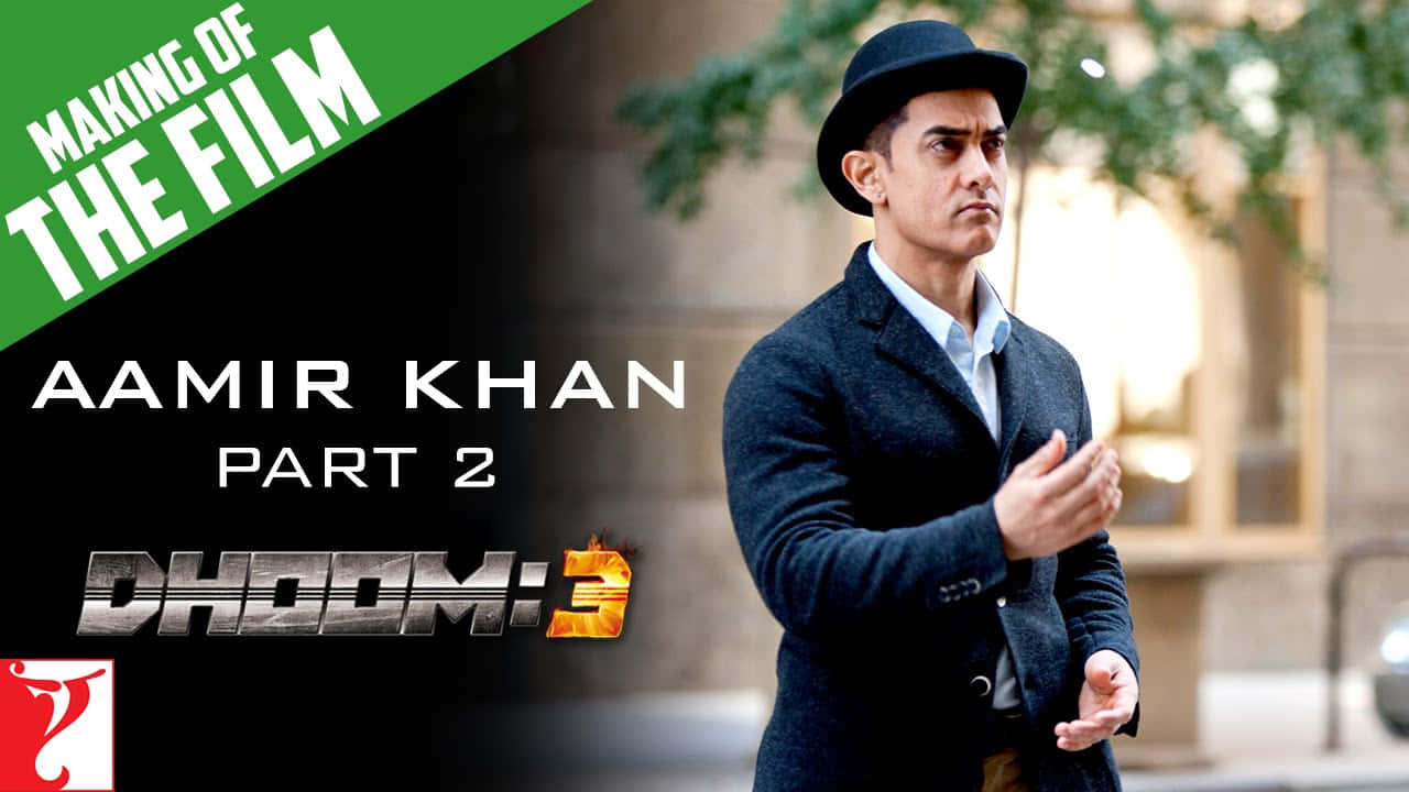 Aamir Khan 桌布 壁紙 — 阿米爾·汗身穿深色外套和軟呢帽，站在戶外，表情嚴肅，文字疊加宣布「電影《幻影車神3》製作特輯」。
