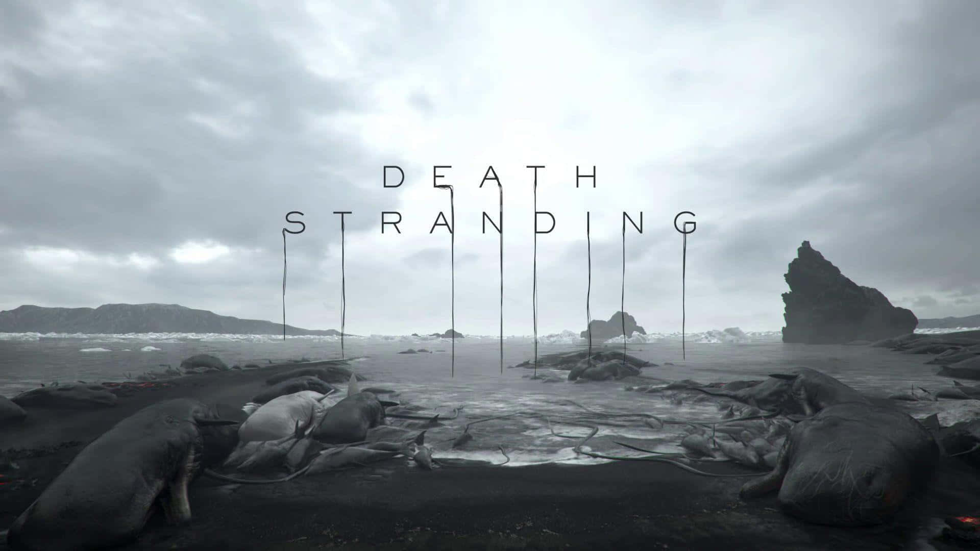 Death Stranding Pc 桌布 壁紙 — 陰天下一片荒涼的黑沙灘，散落的鯨魚屍體上方懸浮著「DEATH STRANDING」標題。