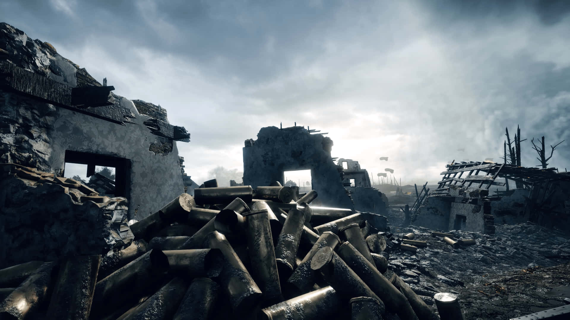 4K Battlefield 桌布 壁紙 — 陰沉多雲的天空下，戰火摧殘的景觀中，廢墟建築和散落的砲彈。