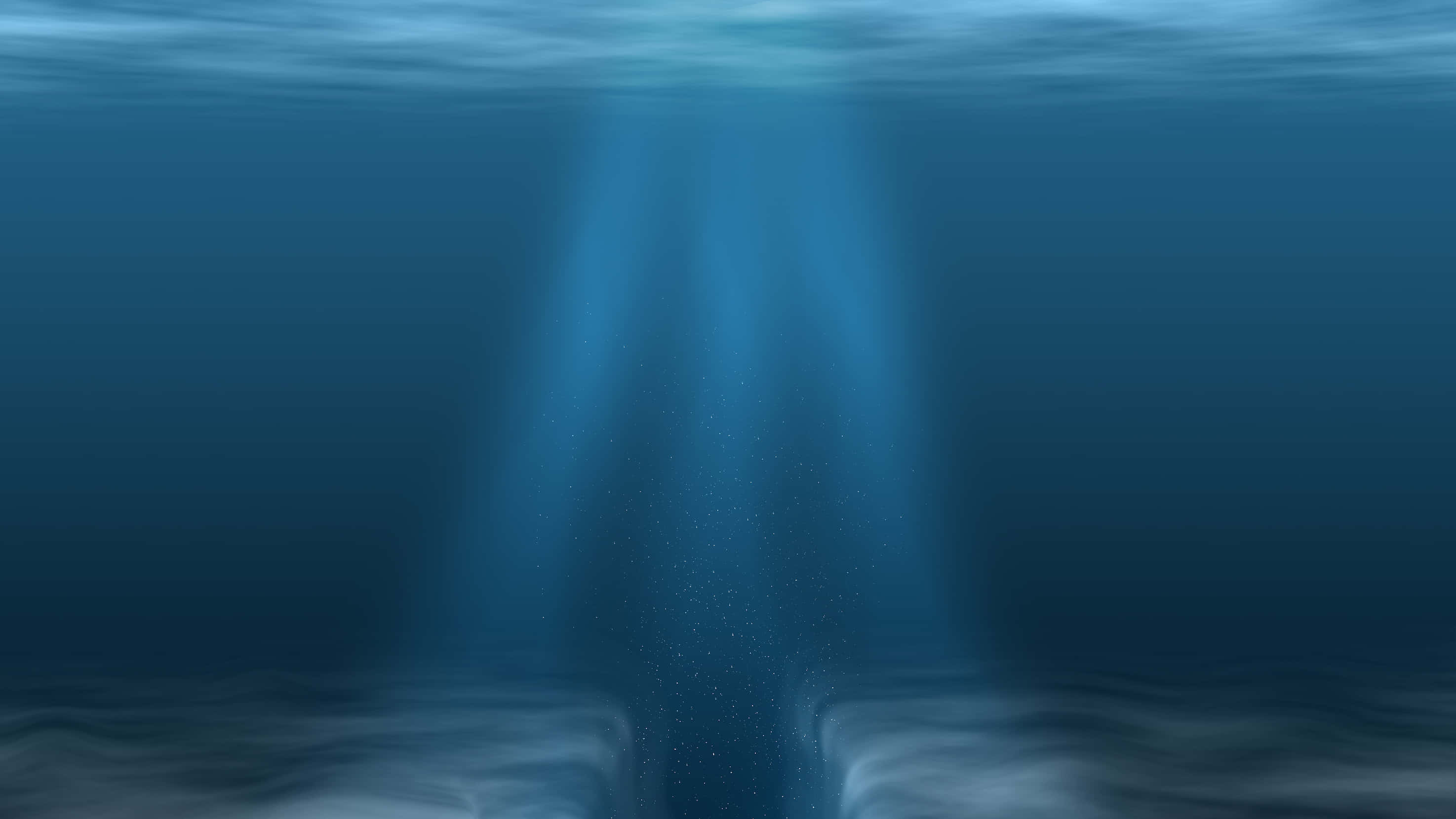 Mariana Trench 桌布 壁紙 — 陽光光束穿透海洋表面，照亮黑暗海床上漂浮的微粒。
