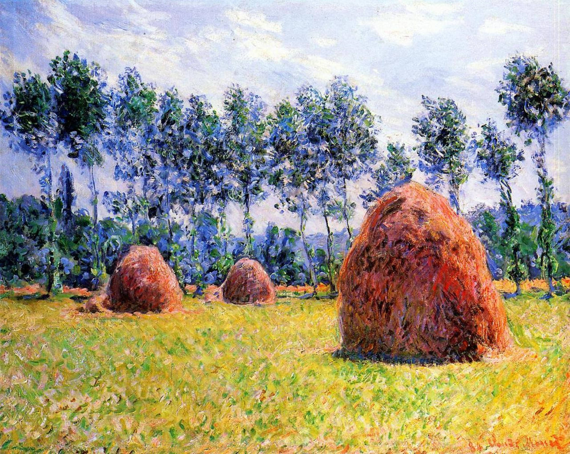 Monet 桌布 壁紙 — 陽光明媚的田野裡有三個巨大的金色乾草堆，淡藍色的天空點綴著蓬鬆的白雲。