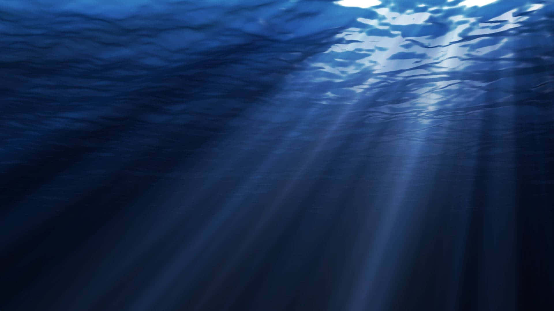 水下動畫 桌布 壁紙 — 陽光穿透深藍色海浪，營造出寧靜的水下光芒。