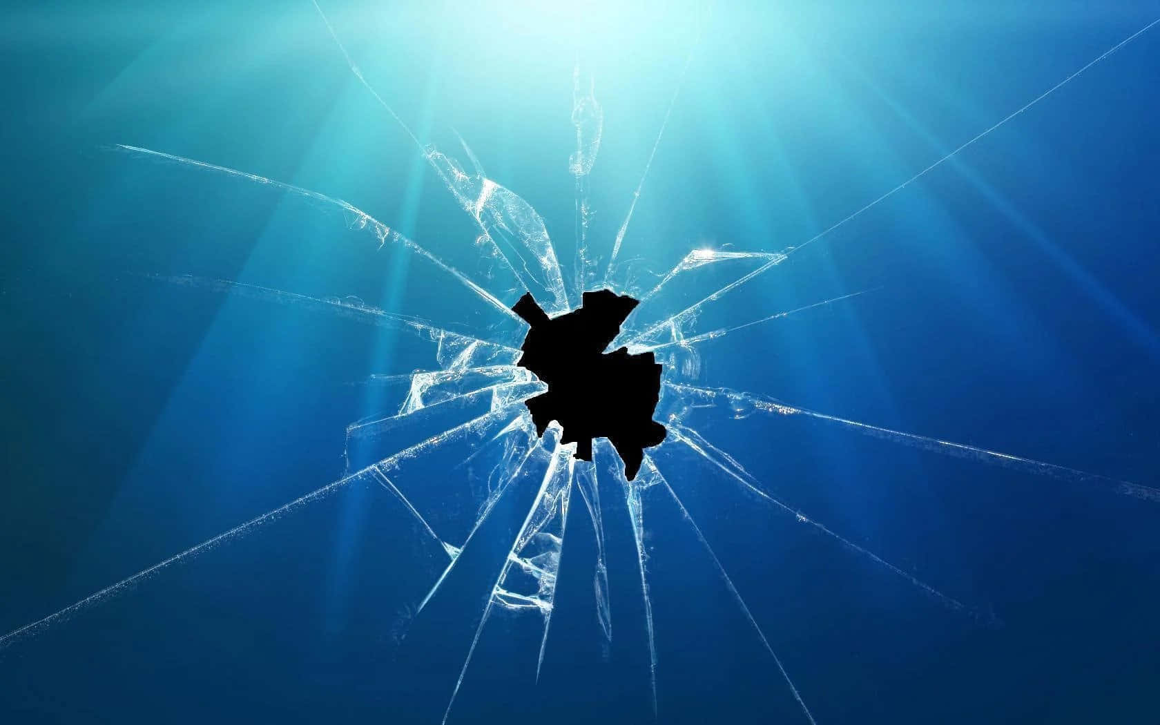 Broken 桌布 壁紙 — 陽光穿過一塊破碎的玻璃板，中央有一個黑洞，在深藍色的水中輻射出裂紋。