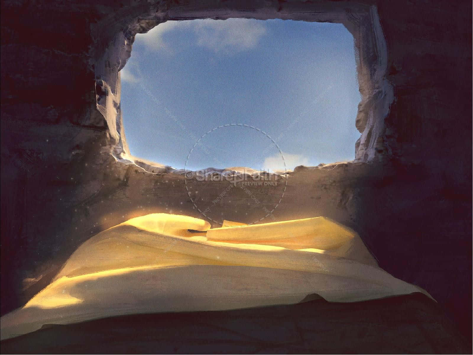 Empty Tomb 桌布 壁紙 — 陽光穿過崎嶇的洞穴開口，照亮下方金色的沙丘，映襯著清澈的藍天。