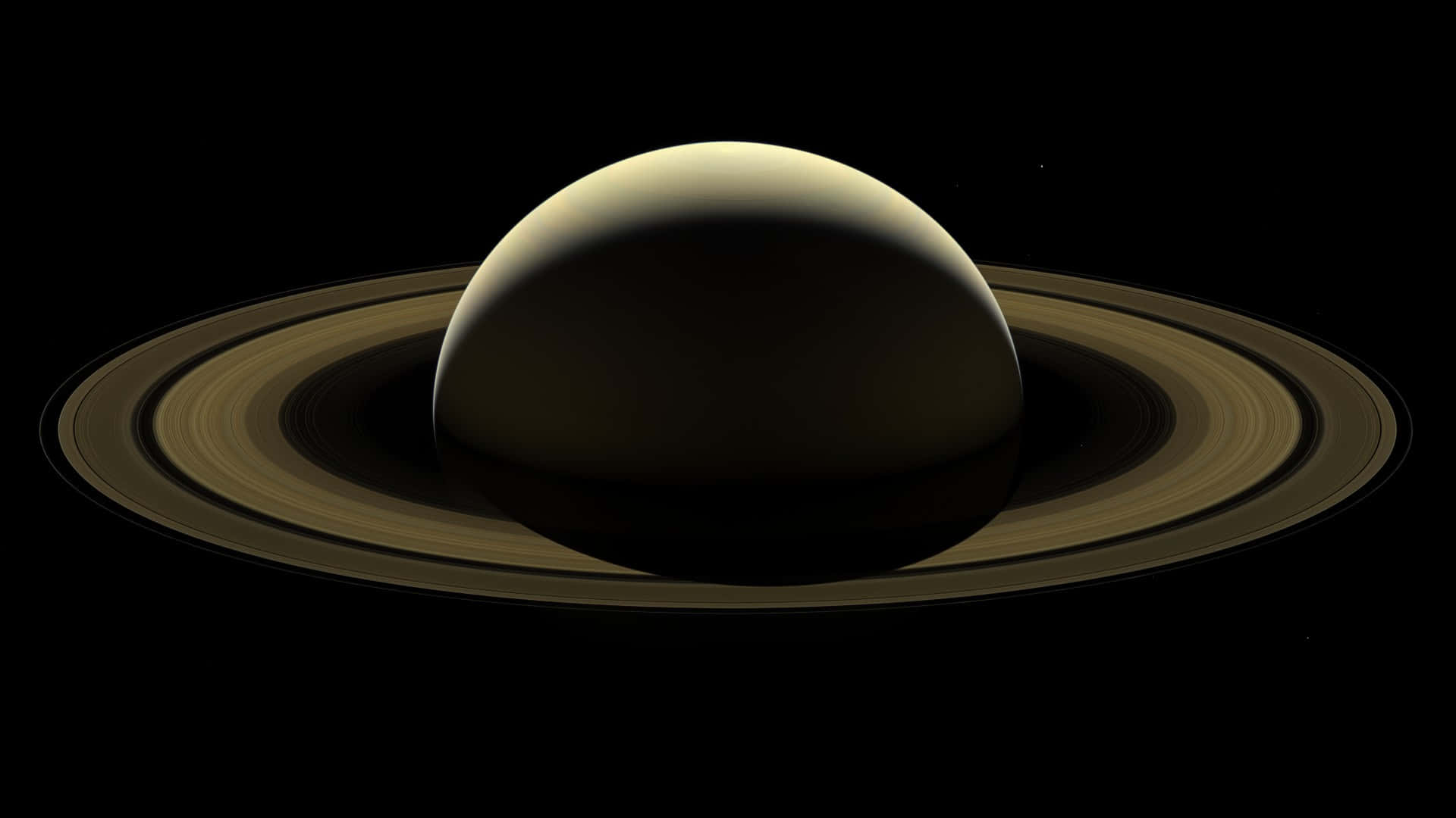土星 桌布 壁紙 — 雄偉的土星及其標誌性的光環在深邃的太空黑暗中柔和地發光。