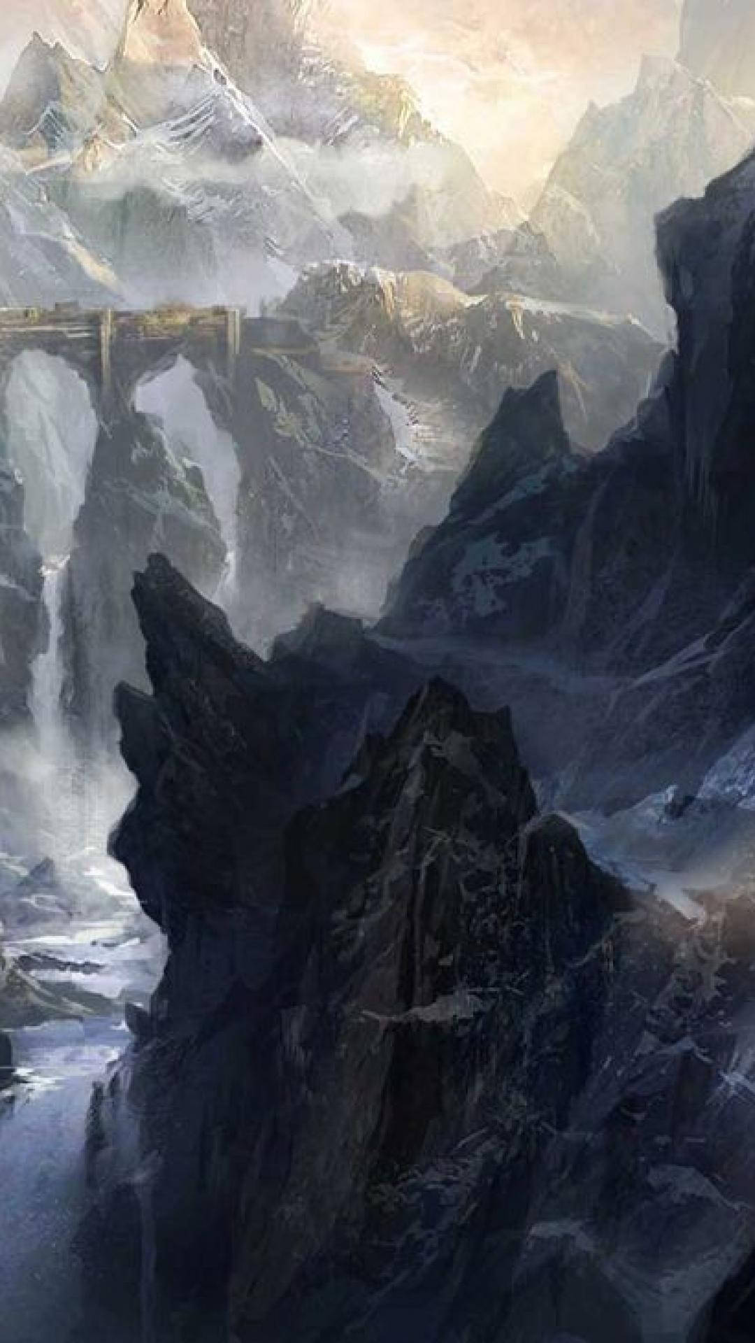 Inquisition 桌布 壁紙 — 雄偉的山脈，白雪覆蓋的山峰，以及一座橫跨深峽谷的石橋，峽谷中充滿薄霧和層疊瀑布。